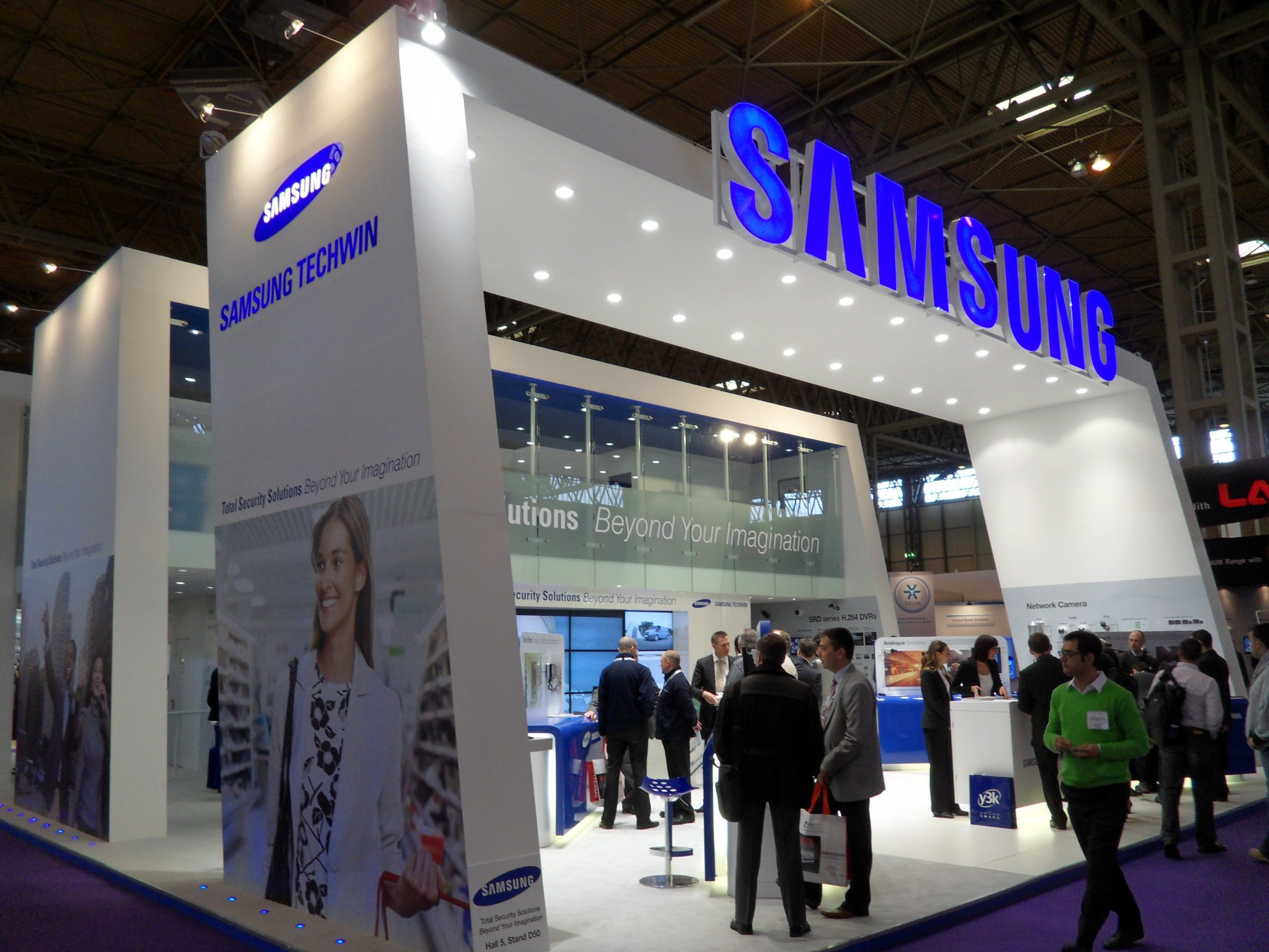 Samsung Techwin exhibition entrance with visitors and corporate signage